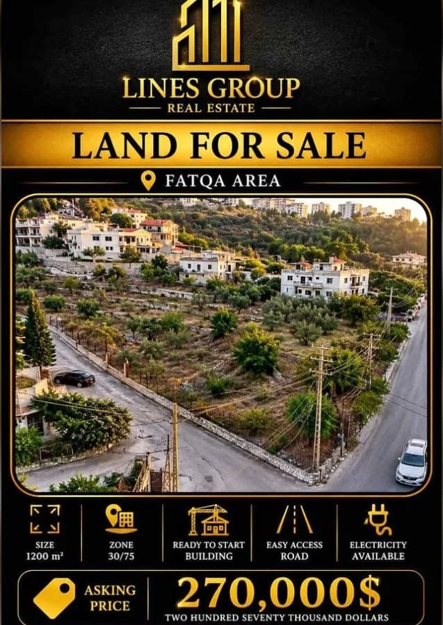 Terraced building plot in Fatqa with road access and village houses beyond