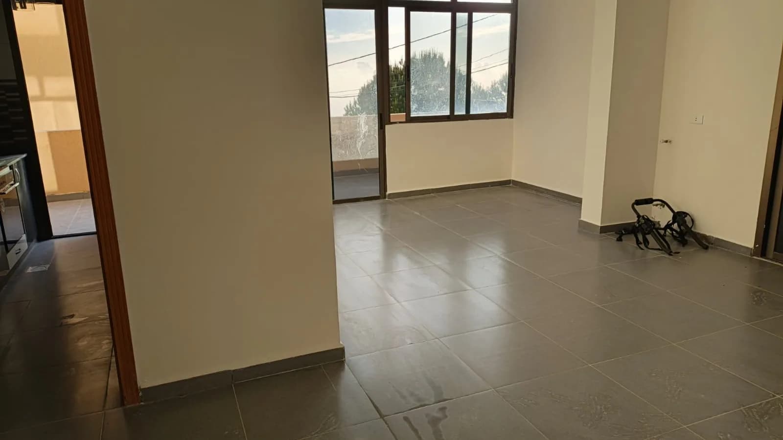 Main salon of the Ghedras apartment with windows across two walls